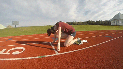 An athlete doing a sprint start.