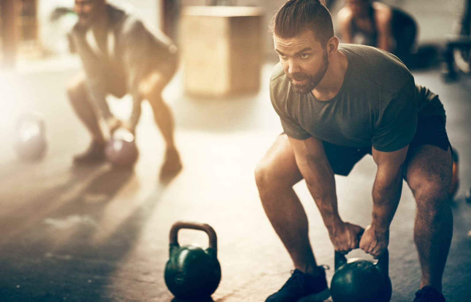 An athlete lifting a kettlebell.