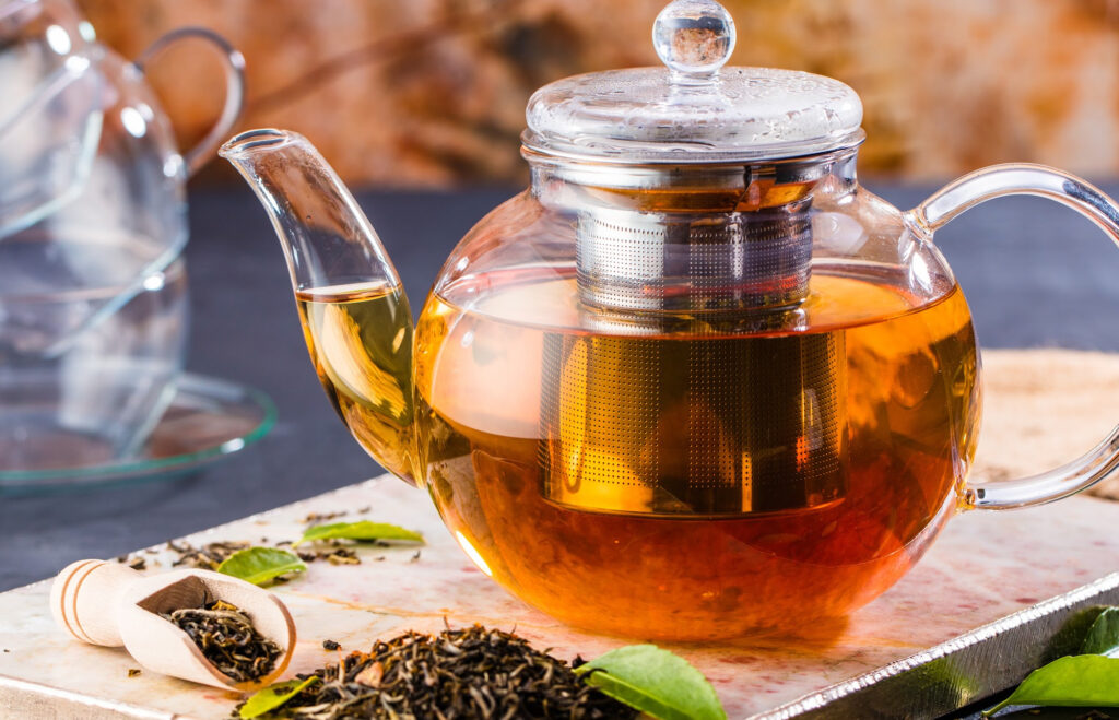 Ashwagandha tea in a glass teapot.