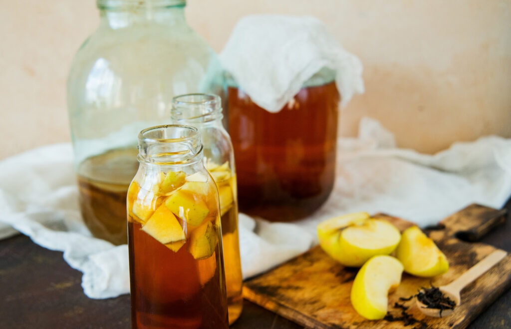 Probiotic kombucha juice in small jars.