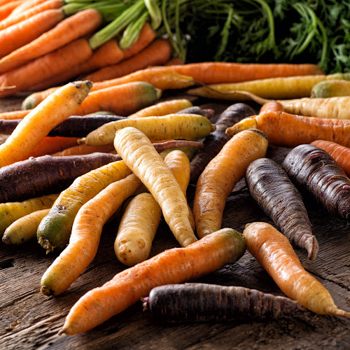 Carrots with a wooden background